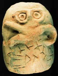 A bizarre ceramic with "letters" and face from Glozel